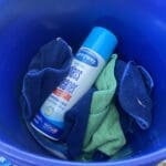 Glass cleaner left in bucket of dirty rags. Now spray can has germs.