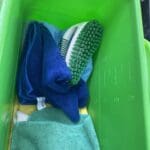 Dirty scrub brush put in with clean rags